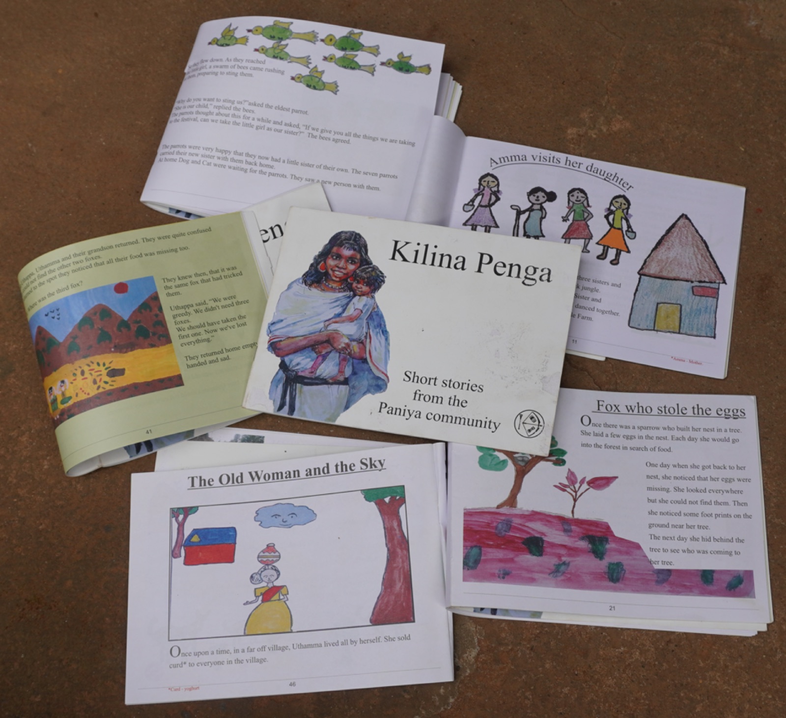 A stack of original short storybooks written by and with the Adivasi community