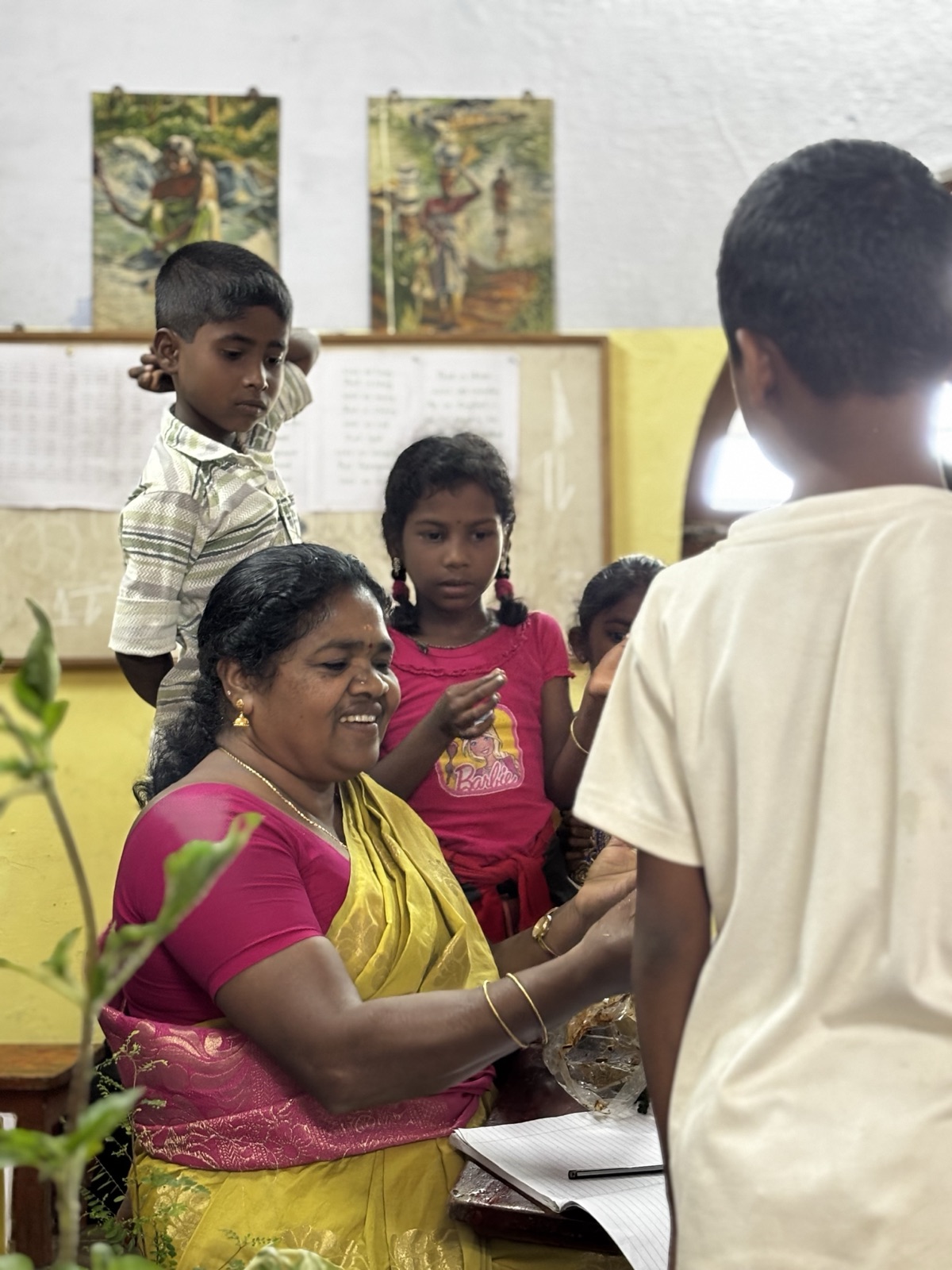 An Adivasi teacher with her students at Vidyodaya School